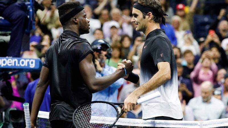 Federer and Tiafoe shake hands after the match. Photo: Justin Lane/EPA