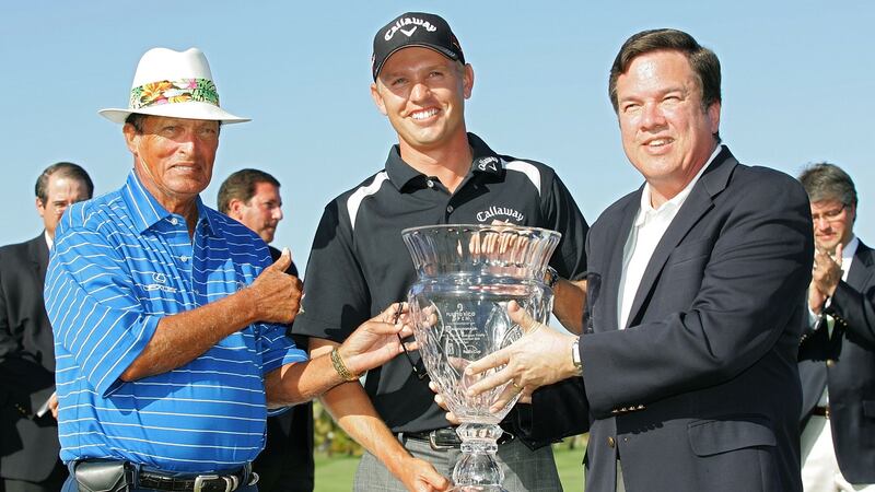 Legendary Puerto Rican golfer Chi Chi Rodriquez (left) presents Derek Lamely and with the Puerto Rico Open trophy after his win in 2010. Photograph: Michael Cohen/Getty Images