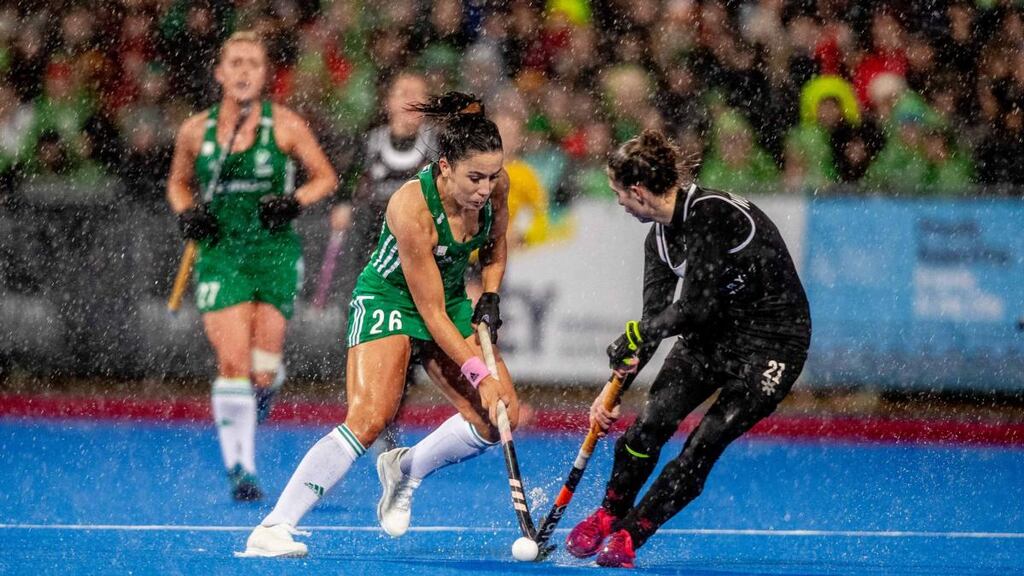 Anna O’Flanagan is challenged by Canada’s Amanda Woodcroft during the first leg. Photograph: Morgan Treacy