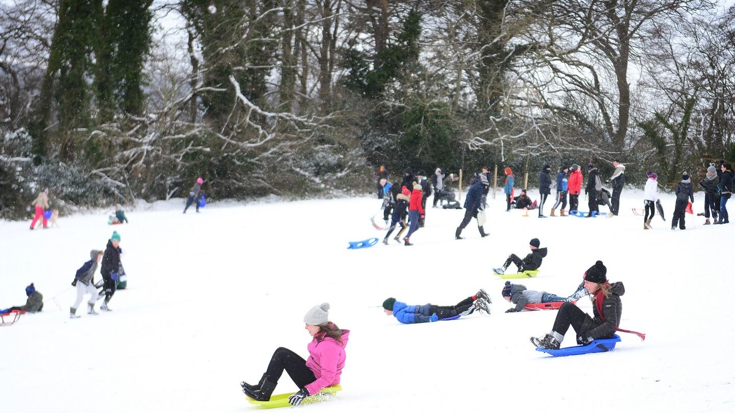 Hundreds of people took to the ‘slopes’ in Bushy Park, Terenure, Dublin on sleighs, sledges and dustbin lids to slide on the snow. Photograph: Bryan O’Brien/ The Irish Times