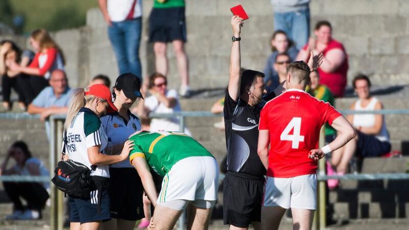 Louth’s James Craven receives a red card from referee Noel Mooney. Photograph: Evan Logan/Inpho