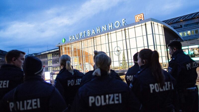 Police officers stand outside the main station in Cologne, Germany. After sexual assaults on women at New Year, there is an increased police presence at the main station. Photograph: Maja Hitij/EPA