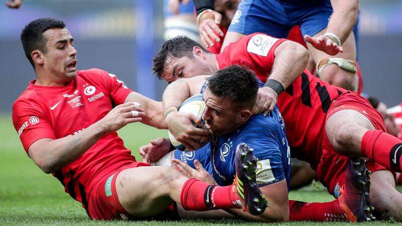 Leinster’s Jack Conan is tackled by Alex Lozowski and Brad Barritt. Photo: Billy Stickland/Inpho