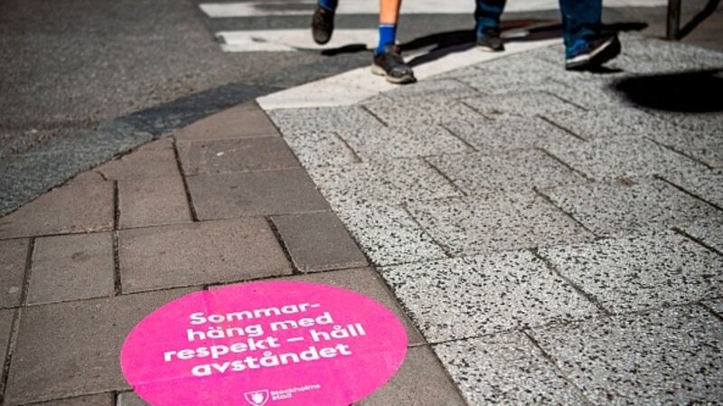A sticker on the streets of Stockholm advises: “Summer: hang out with respect, keep the distance." Sweden largely trusted the public to act sensibly rather than imposing lockdowns. Photograph: Getty Images