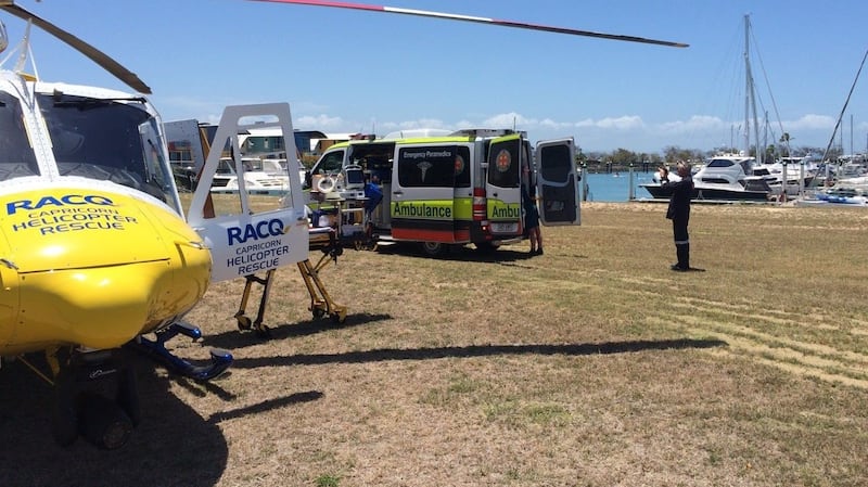 Paramedics treat a man who was attacked by a shark while spearfishing in central Queensland on Friday. Photograph: EPA