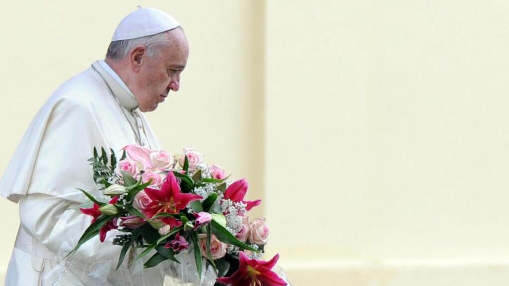 Pope Francis places a floral wreath during his visit to the Austro-Hungarian cemetery in Fogliano Redipuglia. Photograph: Daniel Dal Zennaro/EPA