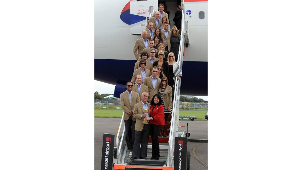 The US Ryder Cup team, plus wives and partners, show off the trophy after touching down at Cardiff Airport. - (Photograph: Reuters)