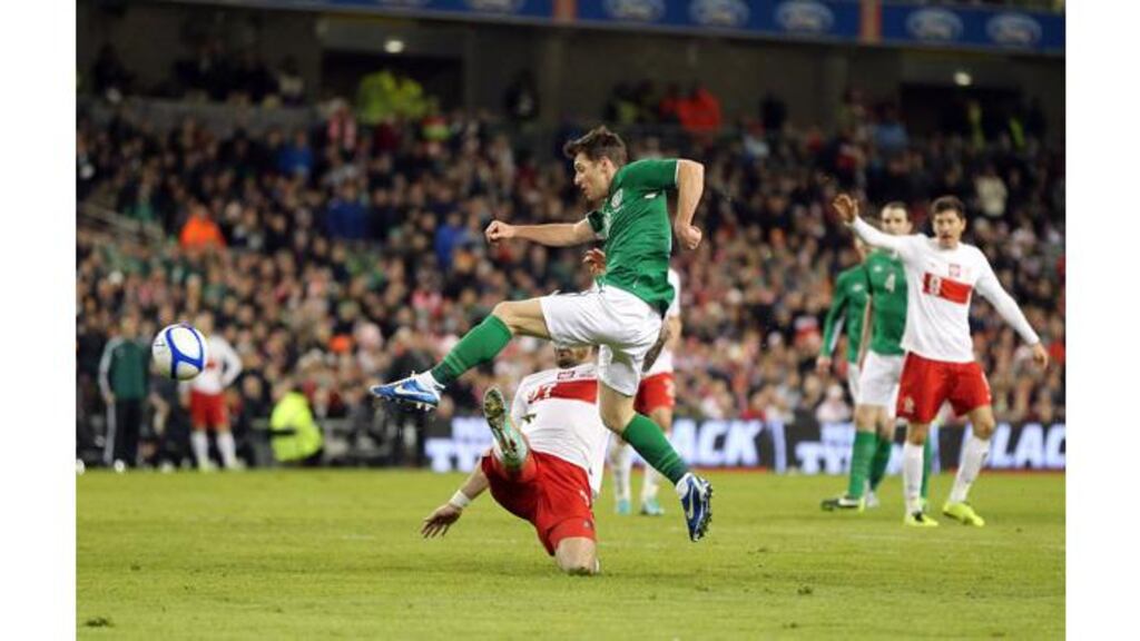 Wes Hoolahan scores the second goal against Poland. Photograph: Cathal Noonan/Inpho