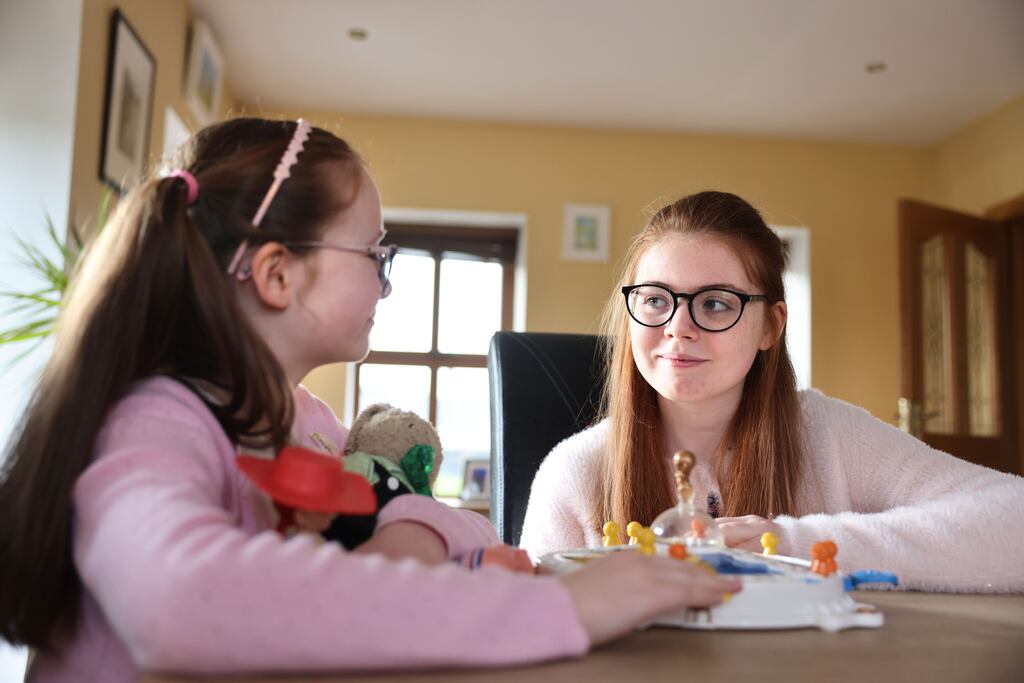 Rebecca Reid, (13, right) who has epilepsy, with her sister Emma at home in Ardagh, Co Longford. Photograph: Dara Mac Donaill