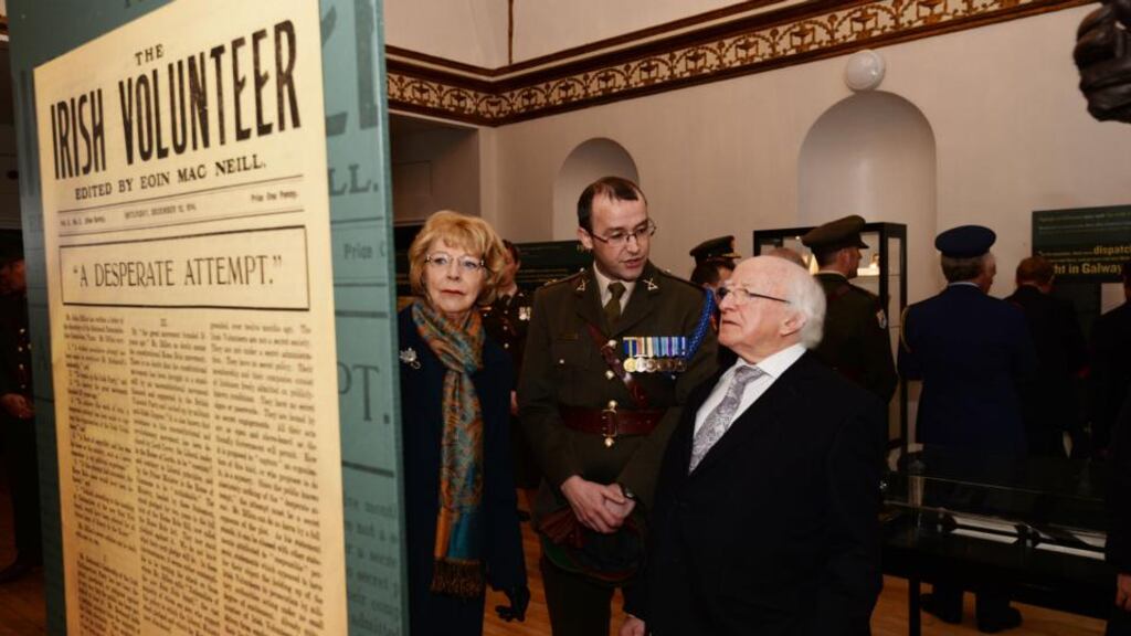President Michael D Higgins and his wife Sabina viewing the military archives with Cmdt Padraic Kennedy after a State ceremony to mark the centenary of the founding of the Irish Volunteers, Óglaigh na hÉireann, in the Garden of Remembrance. Photograph: Alan Betson/The Irish Times