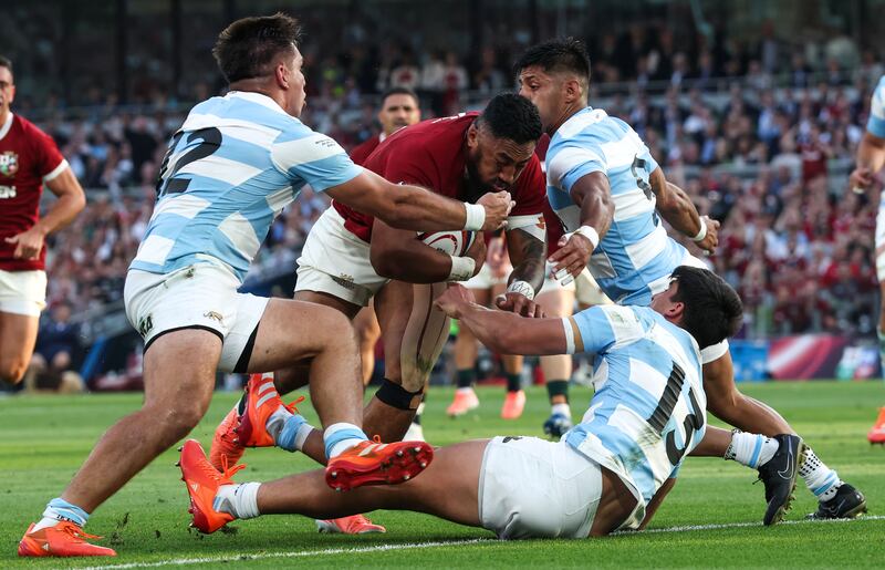 Bundee Aki scores the Lions first try despite Argentina's Gonzalo García, Justo Piccardo and Lucio Cinti Rodrigo Isgró. Photograph: Billy Stickland/Inpho