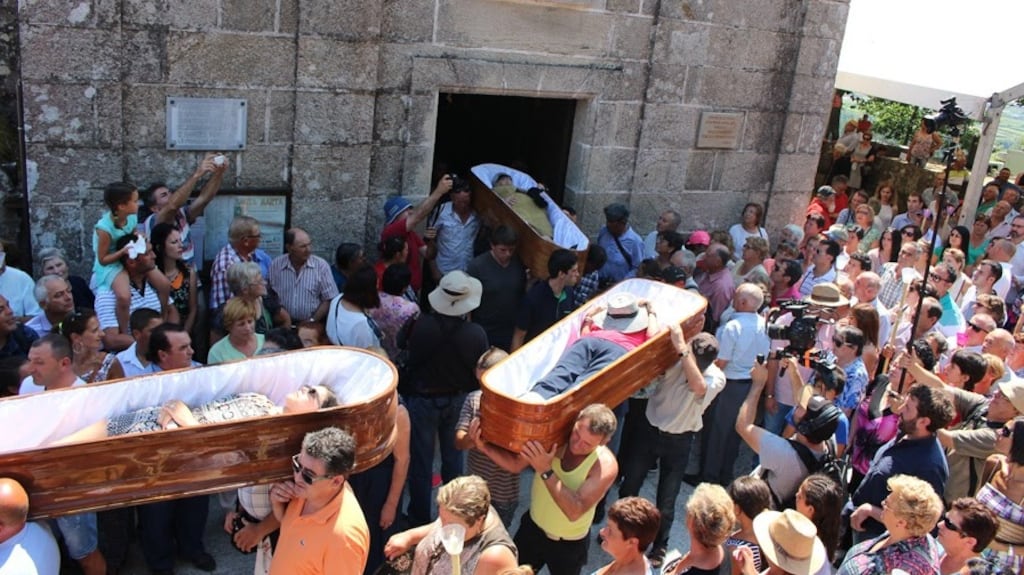 Pallbearers bring out the coffins from the church in Las Nieves in Galicia during the Fiesta de Santa Marta de Ribarteme – the ‘corpses’ have had near-death experiences, and want to give thanks to the saint for sparing their lives. photograph: stuart abraham