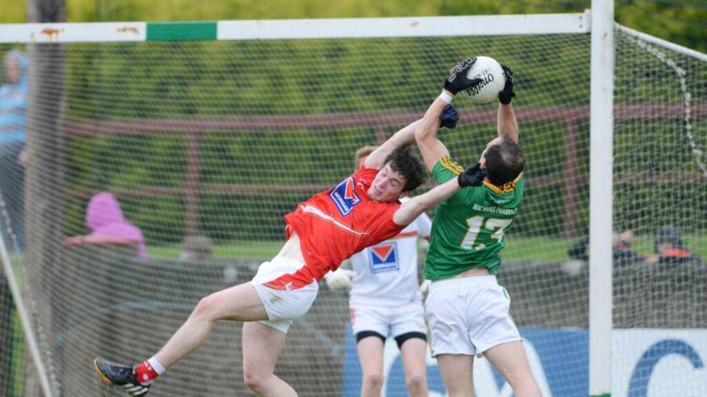 Fergal Clancy of Leitrim claims the ball ahead of Louth’s Eoghan Lafferty during the All-Ireland Round 1B qualifier in Drogheda. Photograph: Ciaran Culligan/Inpho