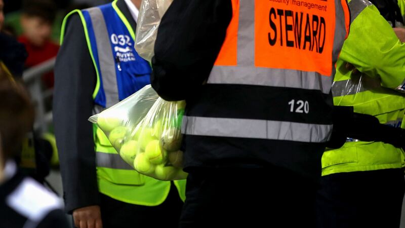 A steward with a bag of confiscated tennis balls at the Aviva Stadium. Photograph: James Crombie/Inpho
