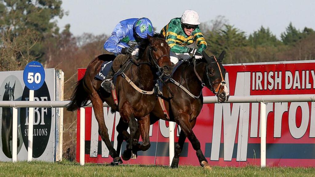 Ruby Walsh on Hurricane Fly comes home to win ahead of Tony McCoy on Jezki in the Ryanair Hurdle at the Leopardstown Christmas Festival. Photograph: Inpho