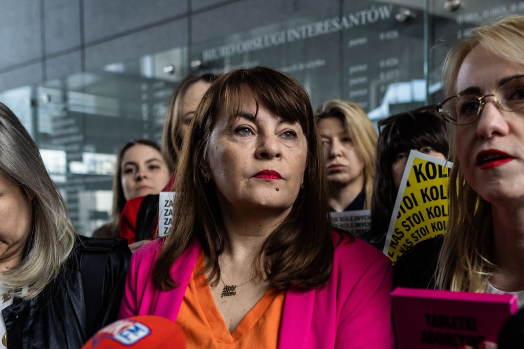 Polish activist Justyna Wydrzynska speaks to journalists at the district court in Warsaw. Photograph: Wojtek Radwanski/Getty Images