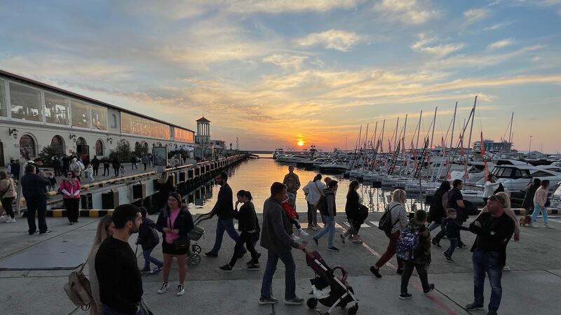 Tourists in Sochi, beside the Black Sea in southern Russia. The city has restricted entry to bars and restaurants to people who have digital passes showing they have been vaccinated against Covid-19. Photograph: Daniel McLaughlin