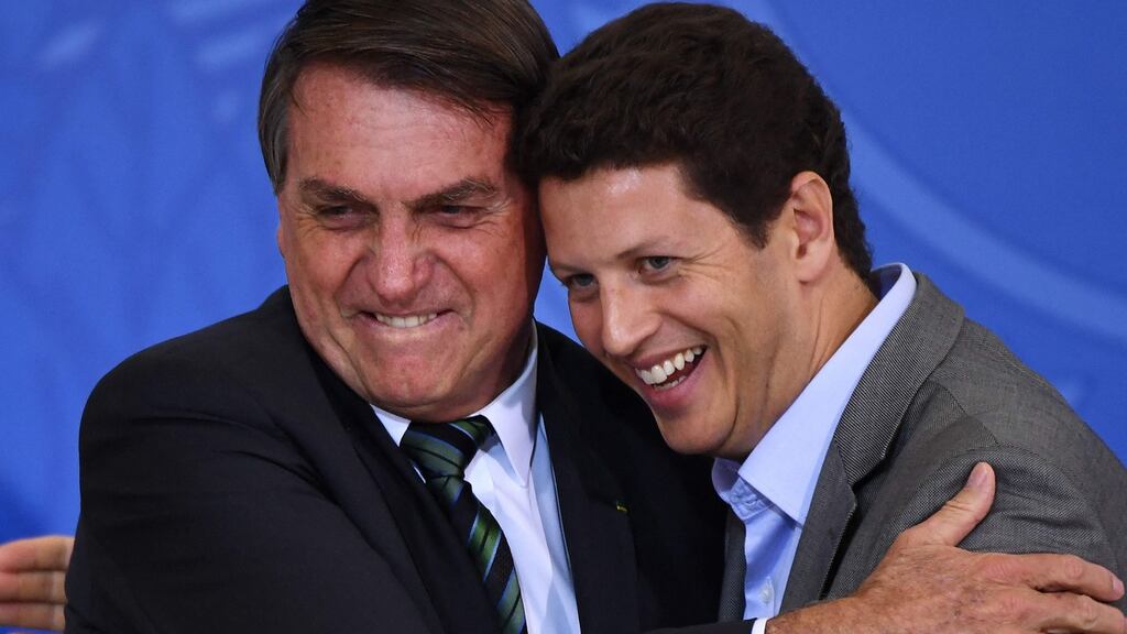 Brazilian president Jair Bolsonaro with controversial former environment minister Ricardo Salles who announced his resignation on Wednesday. Photograph: Evaristo Sa/AFP/Getty Images