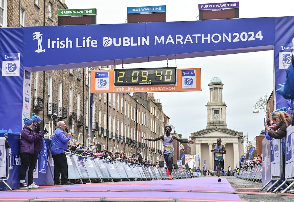 Hiko Tonosa, left, approaches the finishing line at last year's Dublin Marathon. Photograph: Sam Barnes/Sportsfile