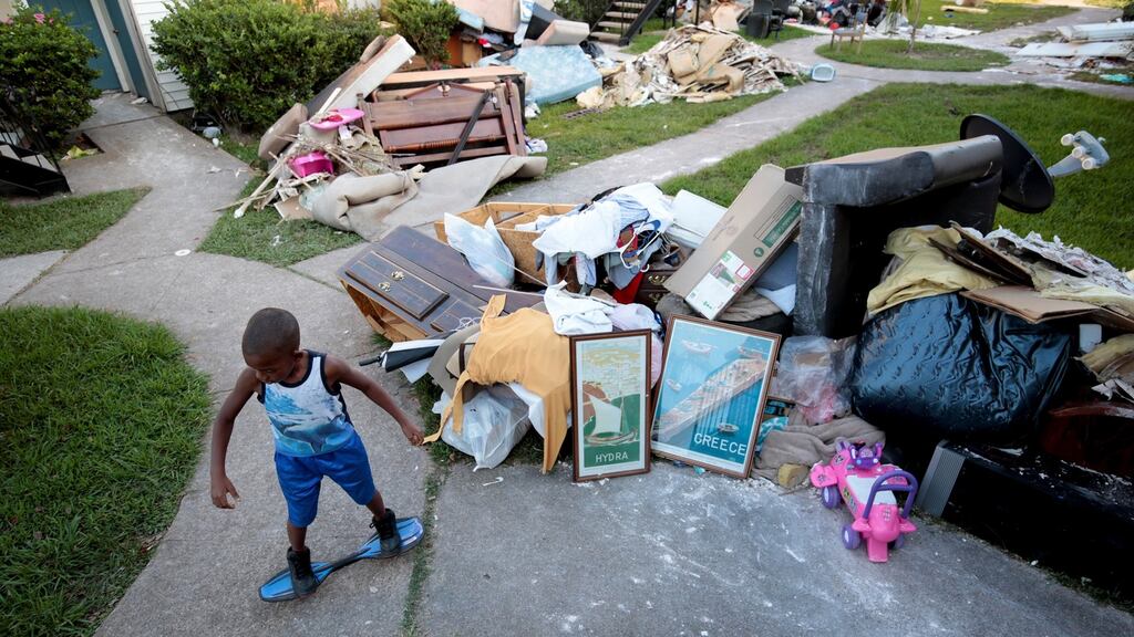 Darius Smith, 9, is surrounded by water damaged property as he plays at Crofton Place Apartments in the aftermath of Hurricane Harvey in Houston, Texas. Photograph: Chris Aluka Berry/Reuters
