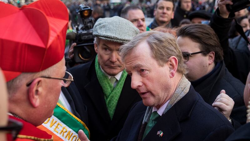Cardinal Timothy Dolan, the Archbishop of New York, and Taoiseach Enda Kenny speak with each other during the annual St. Patrick’s Day parade in New York City. Photograph: Drew Angerer/Getty Images