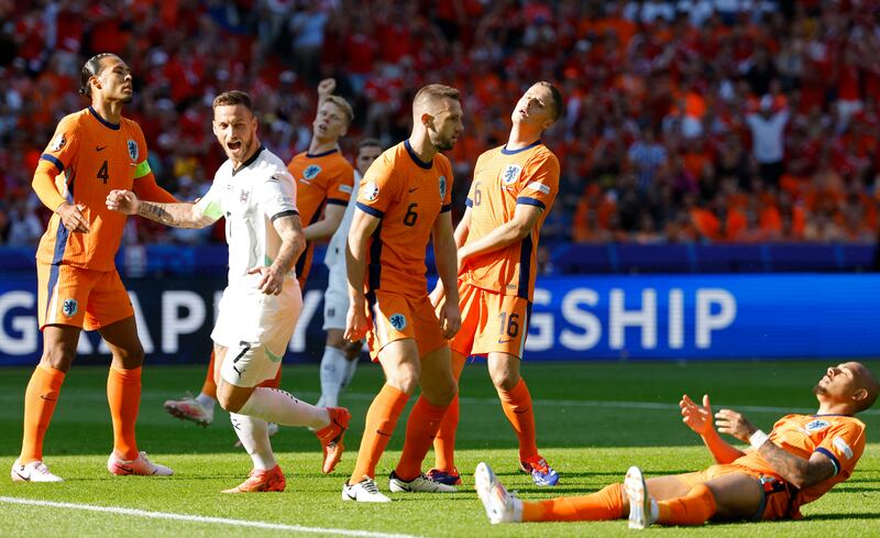 Netherlands' Donyell Malen reacts after scoring an own goal to give Austria the lead. Photograph: Odd Andersen/AFP via Getty Images