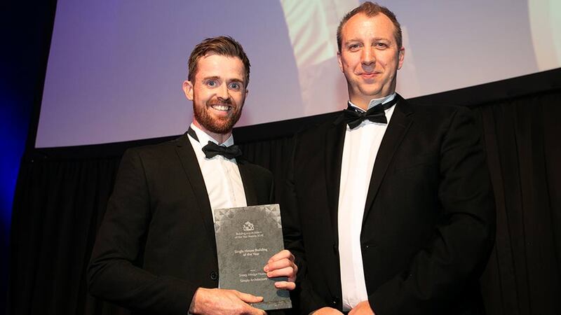 Ronan Holohan, Managing Director, MILLIMETRE DESIGN presents the Single House Building of the Year award to Gareth Sullivan, Simply Architecture.