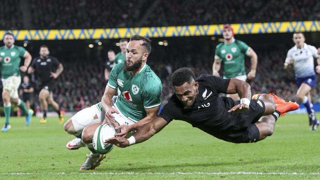 Jamison Gibson-Park wins the footrace to deny Sevu Reece a try during Ireland’s win over the All Blacks. Photograph: Ken Sutton/Inpho