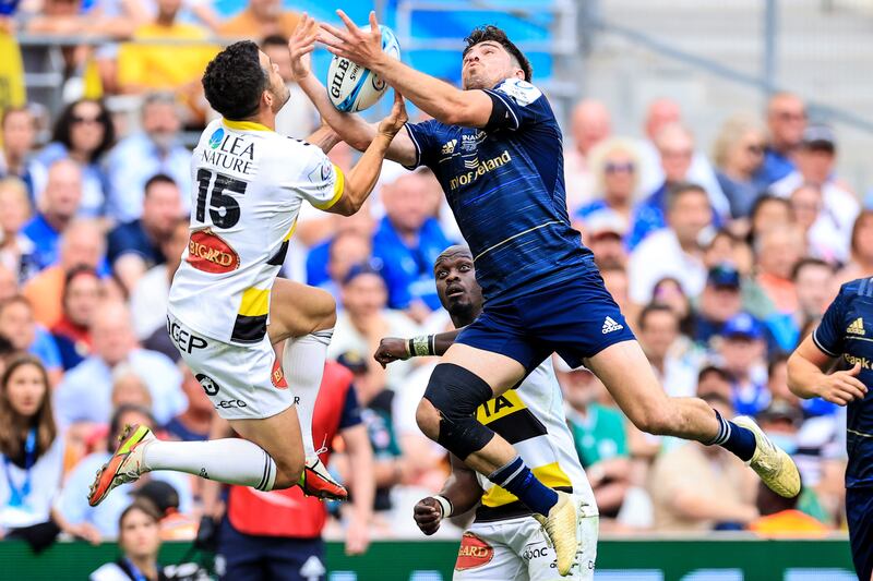 La Rochelle's Brice Dulin competes in the air with Leinster's Jimmy O'Brien during the Champions League final at The Orange Velodrome in Marseille. Photograph: Billy Stickland/Inpho