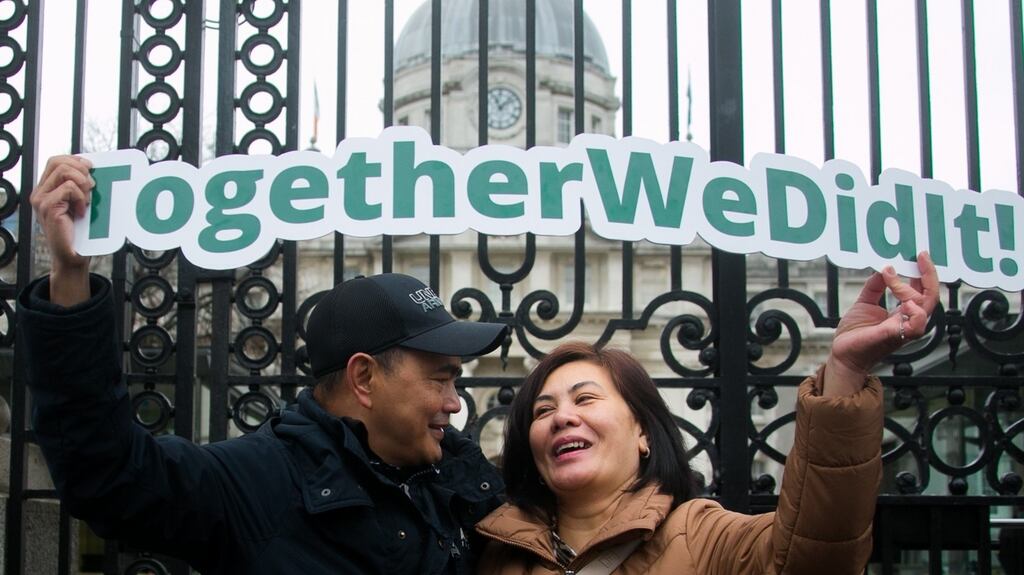Jason Montinegro (founder member of justice for the undocumented) & Phess Montinegro outside Government Buidlings after scheme was announced. Photograph: Gareth Chaney/Collins