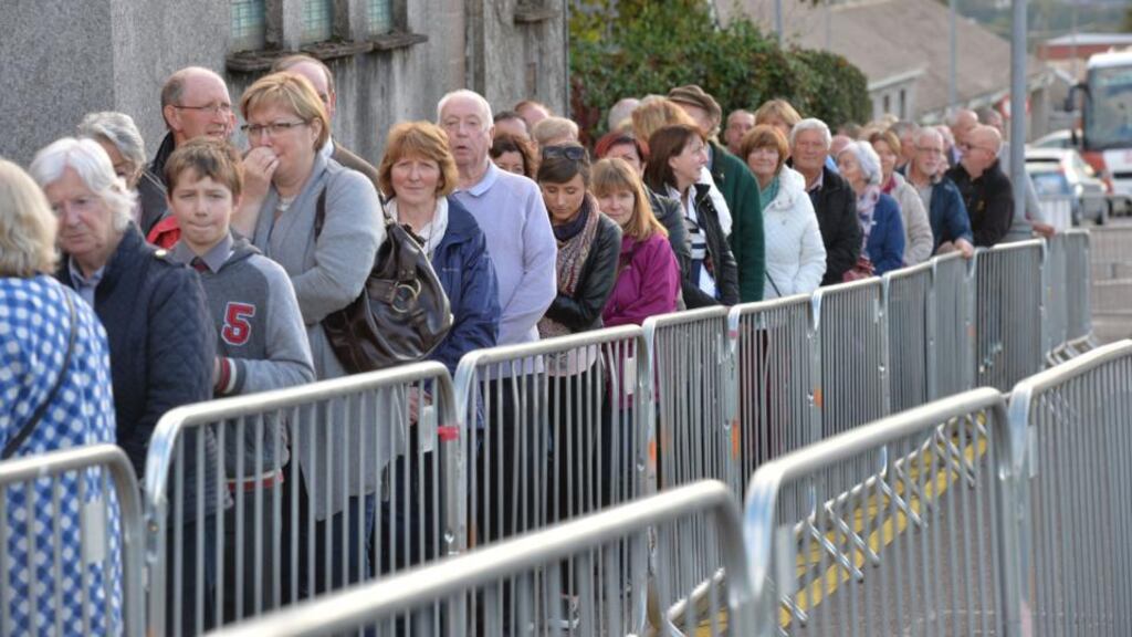 Members of the public line up to sign books of condolances for Comdt Thomas Kent at St Michael’s Garrison Church, Collins Barracks, Cork, ahead of his State funeral on Friday. Thomas Kent was one of the 16 men executed in 1916 following the Easter Rising. Photograph: Alan Betson