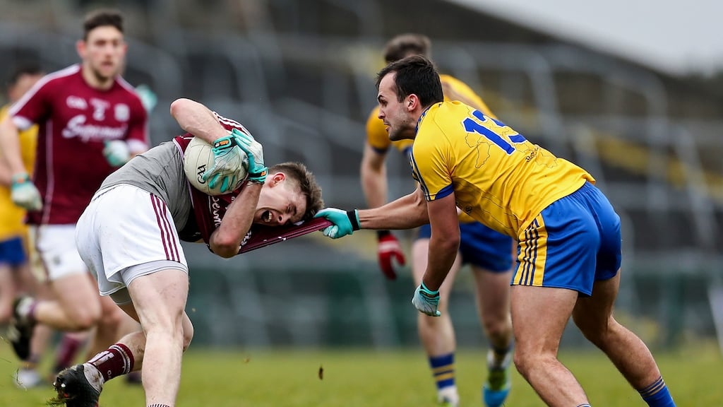 Galway’s David Wynne comes under pressure from Roscommo’s Donie Smyth at Hyde Park. Photograph: Laszlo Geczo/Inpho