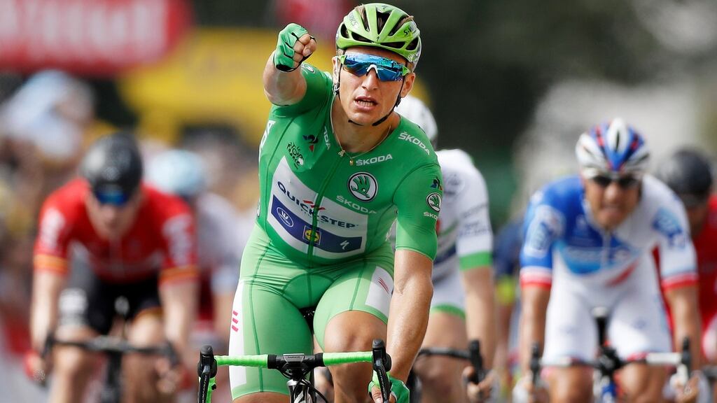 Germany’s Marcel Kittel, wearing the best sprinter’s green jersey, celebrates as he crosses the finish line during the 11th stage of the 104th edition of the Tour de France between Eymet and Pau. Photo: Lionel Bonaventure/Getty Images