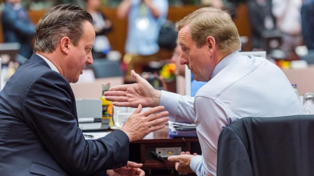 British prime minister David Cameron, speaks to Taoiseach Enda Kenny during a round table meeting at an EU summit in Brussels. Photograph: AP