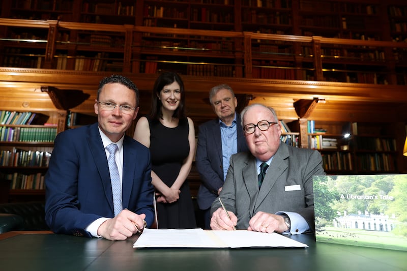 Minister of State Patrick O’Donovan, Katie Morrisroe, Dr Tony Boylan and Richard Ryan sign the agreement for the loan with the State. Photograph: Maxwells