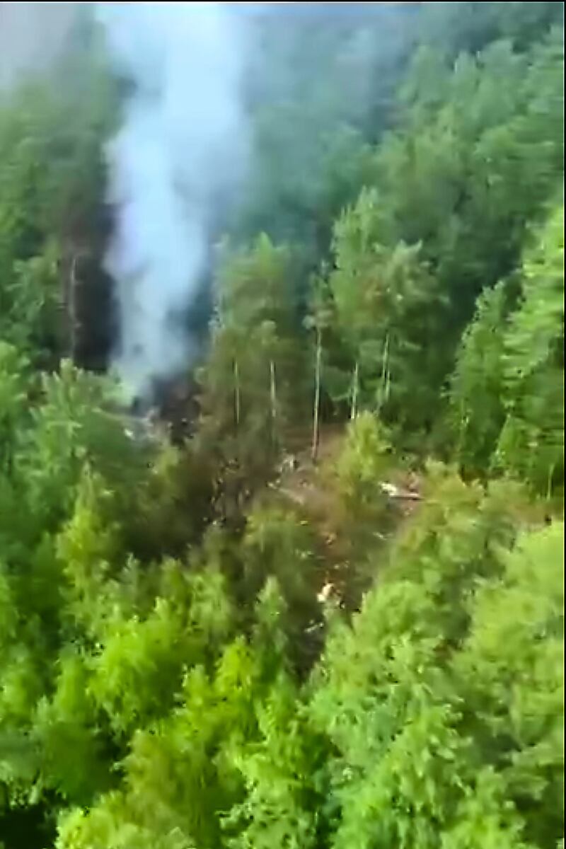 Smoke rises from the crash site. Photograph: Russia Emergency Situations Ministry/AP