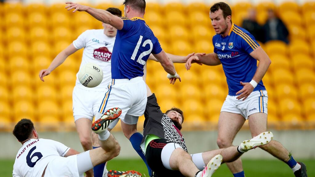 Longford’s Michael Quinn scores his team’s third goal against Kildare. Photograph: James Crombie/Inpho