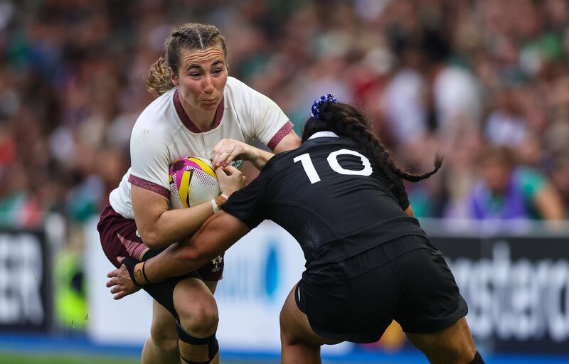 Ireland's Eve Higgins collides with Ruahei Demant during the World Cup pool game in Brighton. Photograph: Ben Brady/Inpho