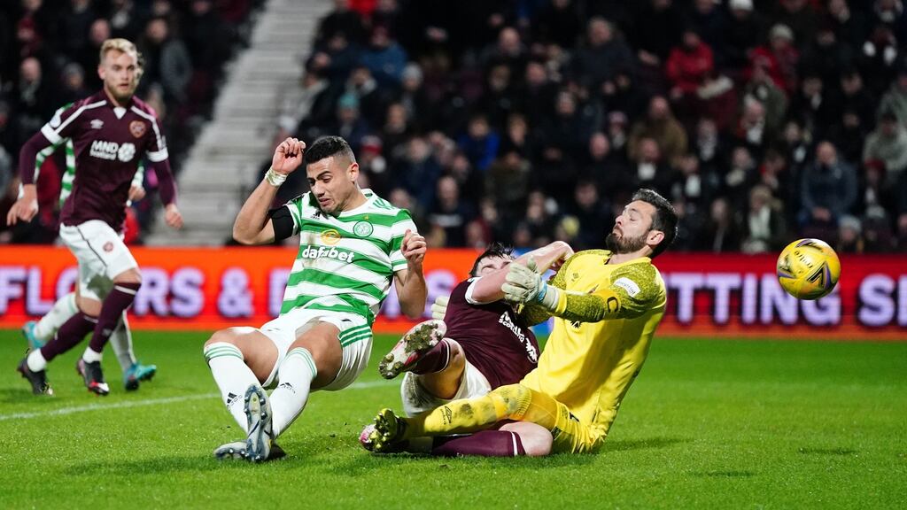 Celtic’s Georgios Giakoumakis scores his side’s second goal during the Premiership match against Hearts at Tynecastle Park in Edinburgh. Photograph: Jane Barlow/PA Wire