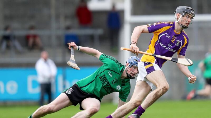 Kilmacud Crokes’ Caolan Conway slips the challenge of  Lucan Sarsfields’ Ciaran Dowling during the Dublin SHC semi-final at Parnell Park. Photograph: Oisin Keniry/Inpho