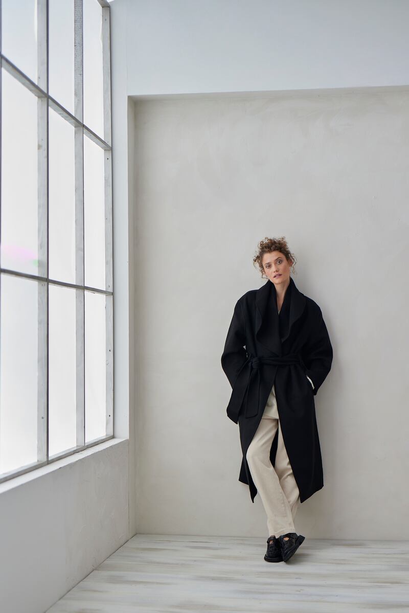 Double-face wool blend tie belt coat €685 by Stylein, recycled cashmere knit €360, and wide soft cotton pant €240 by Cordera. Photograph: Dylan Madden