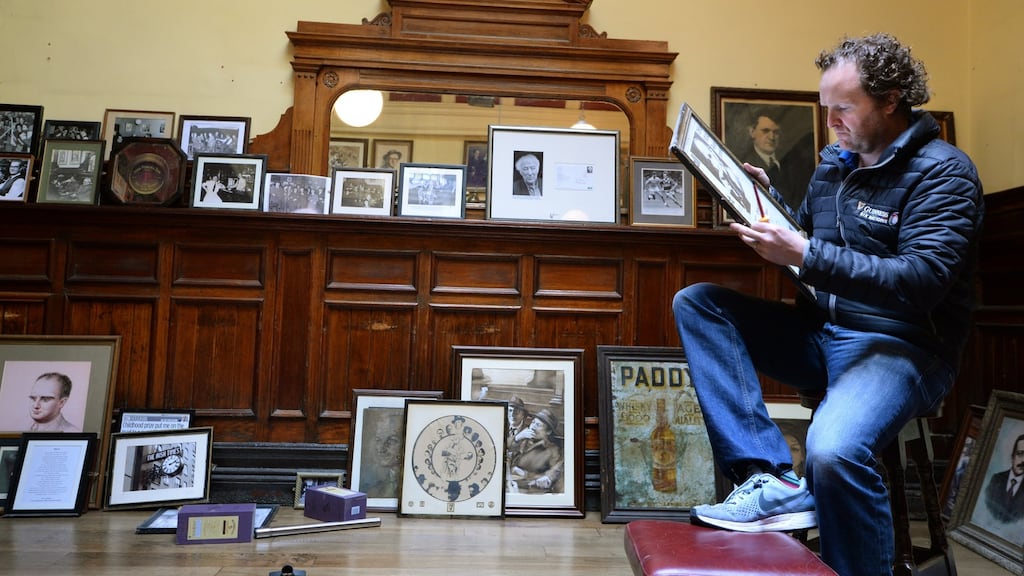 Willie Ahern, of Palace Bar on Fleet Street, Dublin, cleaning up in the closed pub during the coronavirus lockdown. Photograph: Dara Mac Dónaill