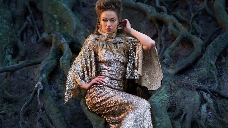 Feather and gold leather neckpiece €395, antique gold sequin gown €995. Photograph: Una Williams