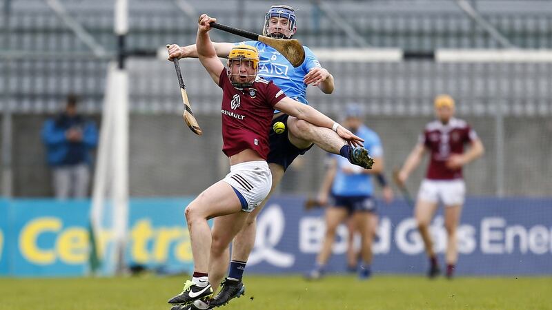 Westmeath’s Davy Glennon and Conor Burke of Dublin challenge for the ball. Photograph: Ashley Cahill/Inpho