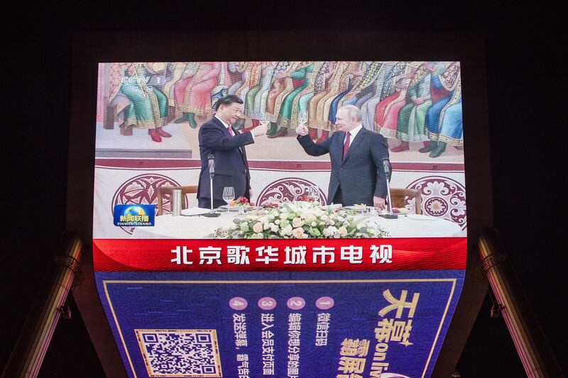 A screen shows Chinese president Xi Jinping raising a glass with Russian president Vladimir Putin in Moscow in March. The war in Ukraine is poisoning relations between Europe and China. Photograph: Wu Hao