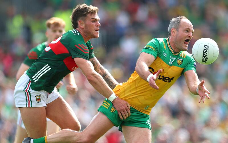 Mayo’s Jordan Flynn tackles Michael Murphy of Donegal during Sunday's All-Ireland SFC round-robin clash at Dr Hyde Park. Photograph: James Crombie/Inpho