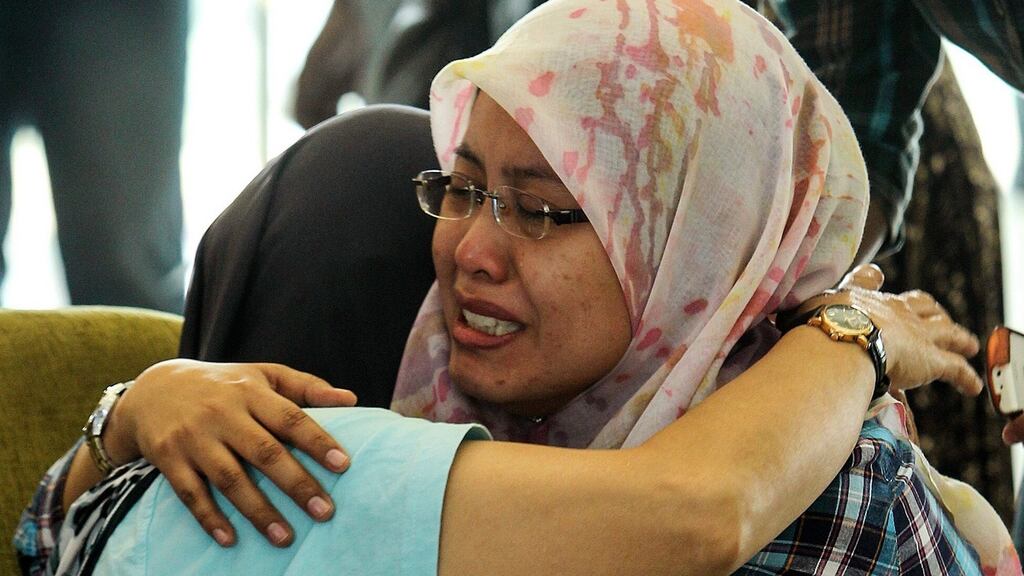 Family members of passengers of missing Malaysia Airlines flight at a hotel in Putrajaya, Malaysia today. A total of 22 aircraft and 40 ships are combing the South China Sea to locate a Malaysia Airlines passenger jet with 239 people on board that was missing and feared crashed at sea. Photograph: EPA/STR