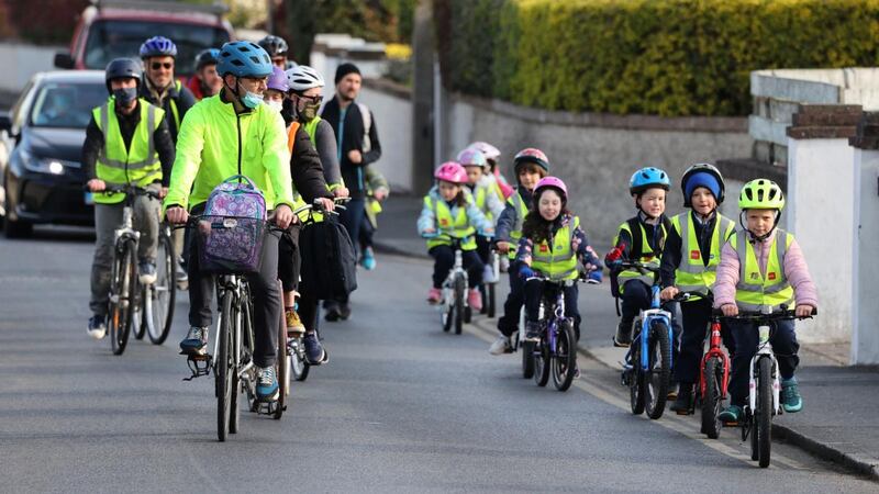 Children cycle to school in a convoy with parents including Ross Kinsella, heading for  Gaelscoil na Fuinseoige in Finsbury Park, Dundrum. Photograph: Nick Bradshaw
