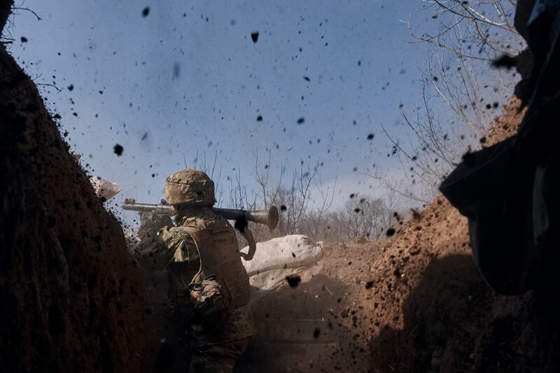 A Ukrainian soldier on the frontline battles with Russian troops near Bakhmut. Photograph: Libkos/AP