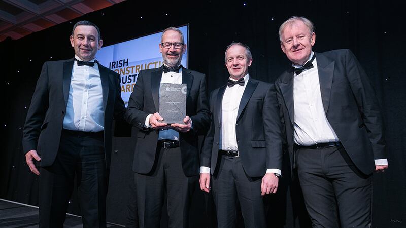 Noel McKernan, general manager, Halt Natural Fire Retardant, presents the Conservation Project of the Year award to the John Paul Construction team.